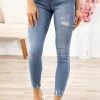 Rewash Bottoms Medium Wash Distressed Hem Mid Rise Jeggings