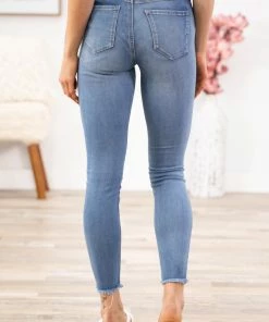 Rewash Bottoms Medium Wash Distressed Hem Mid Rise Jeggings