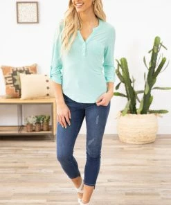 DNA COUTURE Mint Roll Sleeve Notch Neck Top